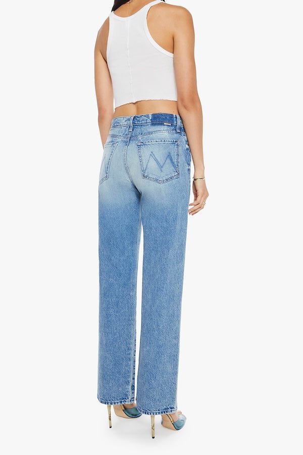 The Dodger Button Sneak Wipeout by MOTHER, trendy mid-blue jeans with a slouchy fit, loose straight leg, and a clean hem. Perfect for a relaxed look with whiskering and knee fading, made from rigid SUPERIOR denim.