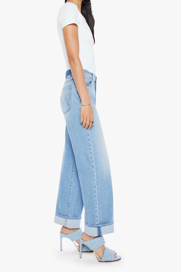 The Dodger Button Hover Cuff Funk N'Flair by MOTHER, trendy low-rise jeans with a slouchy fit, loose straight leg, and vintage-inspired details. Perfect for a relaxed, worn-in look with whiskering, knee fading, and a cuffed hem.