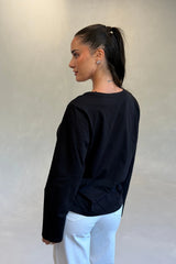Carter V Neck Long Sleeve Top in Black by Sneaky Link, cotton V-neck long sleeve top for effortless everyday layering.
