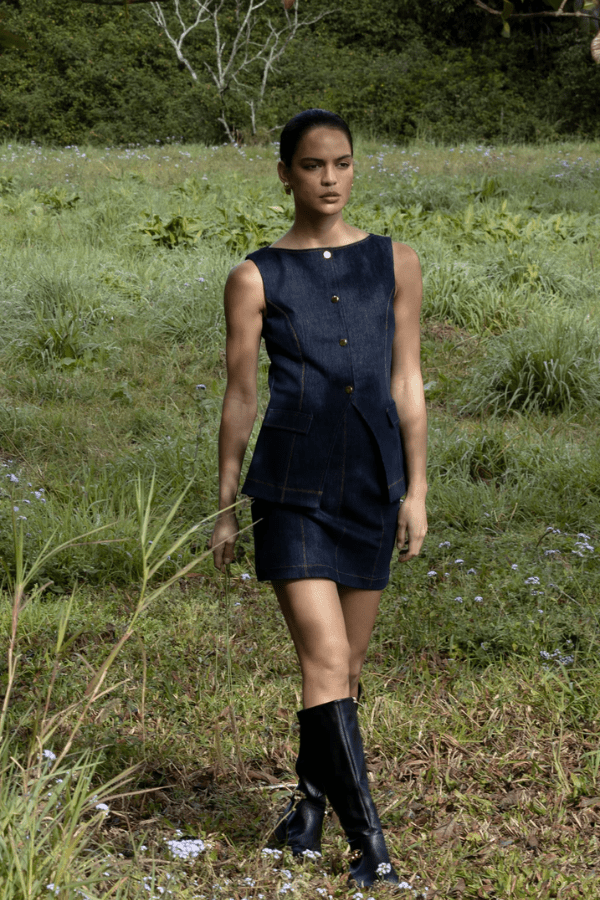 Good Vibes Top Indigo by Pasduchas – Trendy stretch denim with structured fit, gold snap studs, and mock pockets; perfect for chic, coordinated looks.