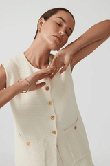 Helena Gilet Ivory by Onte, breathable cotton crochet knit with gold buttons and patch pockets, perfect for trendy layering and elegant casual wear.