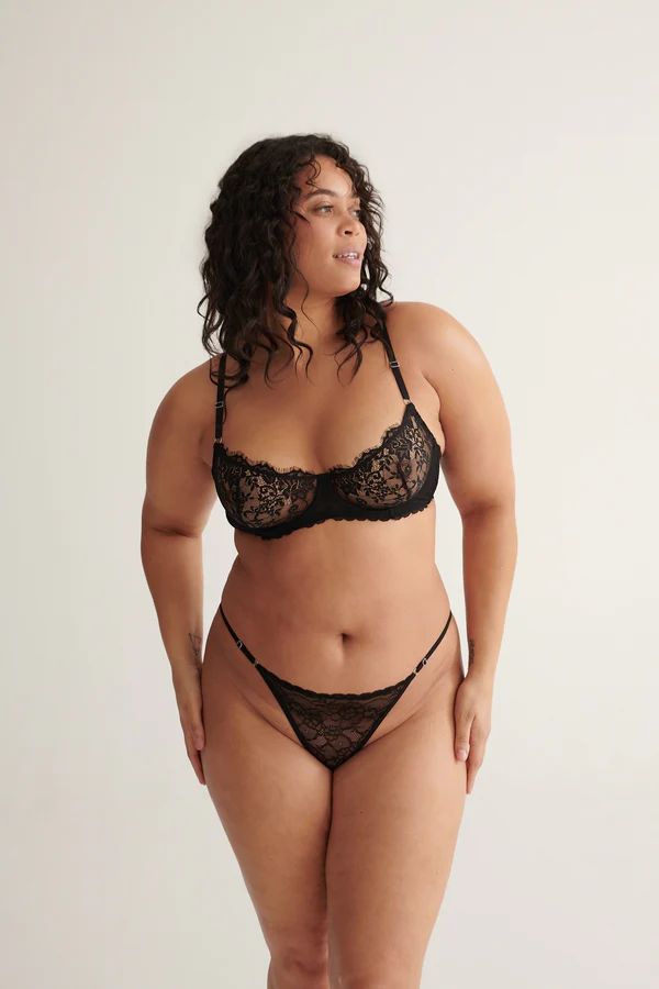 Rosie Thong in Black by Kat the Label, high-cut lace thong with a soft mesh back and adjustable waistband, perfect for comfort and a touch of luxe elegance.
