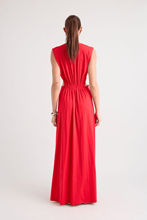 Do For Love Gown Red by Pfeiffer – A trendy low plunge maxi gown with bold hardware and thigh-high split, perfect for turning heads at special occasions.