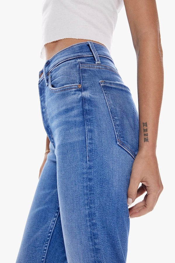 The Tomcat Layover by MOTHER, bestselling high-rise straight leg with button fly, cropped inseam, mid-blue wash with whiskering, perfect for casual, cool vibes.