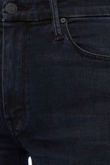 The Roller Fray Night In Venice by MOTHER, trendy high-waisted wide-leg jeans with a frayed hem and dark denim wash. Perfect for a relaxed yet stylish look with a 31-inch inseam and touch of stretch.