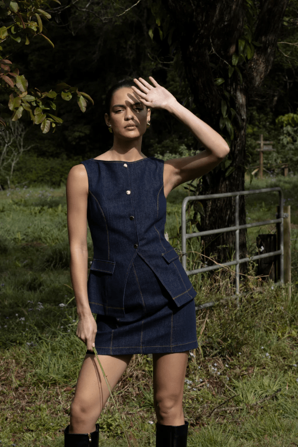 Good Vibes Top Indigo by Pasduchas – Trendy stretch denim with structured fit, gold snap studs, and mock pockets; perfect for chic, coordinated looks.