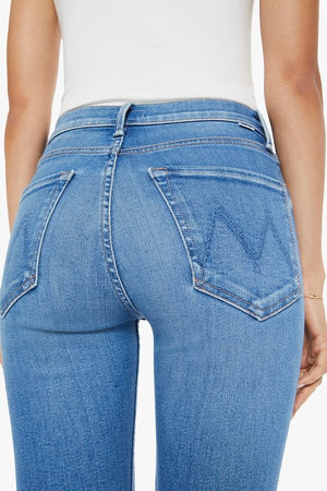 The Tomcat Ankle Piece By Piece by MOTHER, trendy high-rise jeans with a straight leg, button fly, and ankle-length inseam. Perfect for a stylish, everyday look with subtle whiskering and fading.