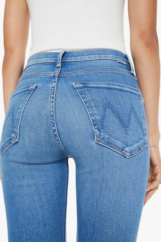 The Tomcat Ankle Piece By Piece by MOTHER, trendy high-rise jeans with a straight leg, button fly, and ankle-length inseam. Perfect for a stylish, everyday look with subtle whiskering and fading.