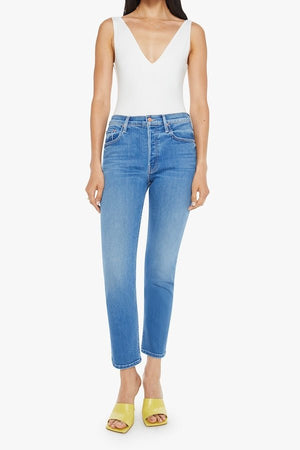 The Tomcat Ankle Piece By Piece by MOTHER, trendy high-rise jeans with a straight leg, button fly, and ankle-length inseam. Perfect for a stylish, everyday look with subtle whiskering and fading.