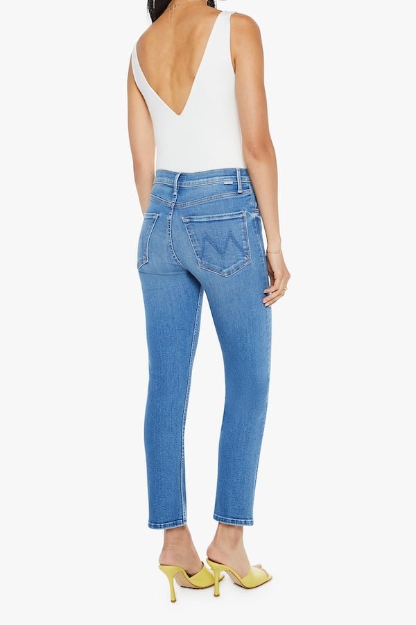 The Tomcat Ankle Piece By Piece by MOTHER, trendy high-rise jeans with a straight leg, button fly, and ankle-length inseam. Perfect for a stylish, everyday look with subtle whiskering and fading.