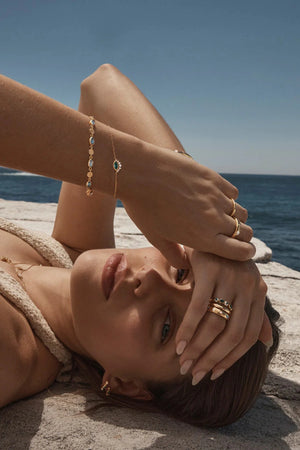 18k Gold Vermeil Hope And Protection Bracelet by By Charlotte, adjustable evil eye bracelet with blue Paraiba gemstone and cubic zirconias.