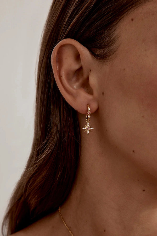 18k Gold Vermeil Starry Night Hoops by By Charlotte - gold hoops with star charms and pink stones, designed for a delicate celestial look.