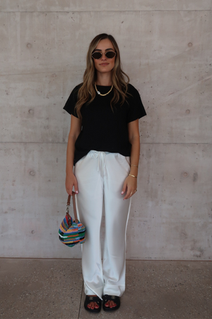 Black Tee by Sneaky Link – Trendy loose-fit 100% cotton classic black tee, a versatile essential for any capsule wardrobe and everyday casual looks.