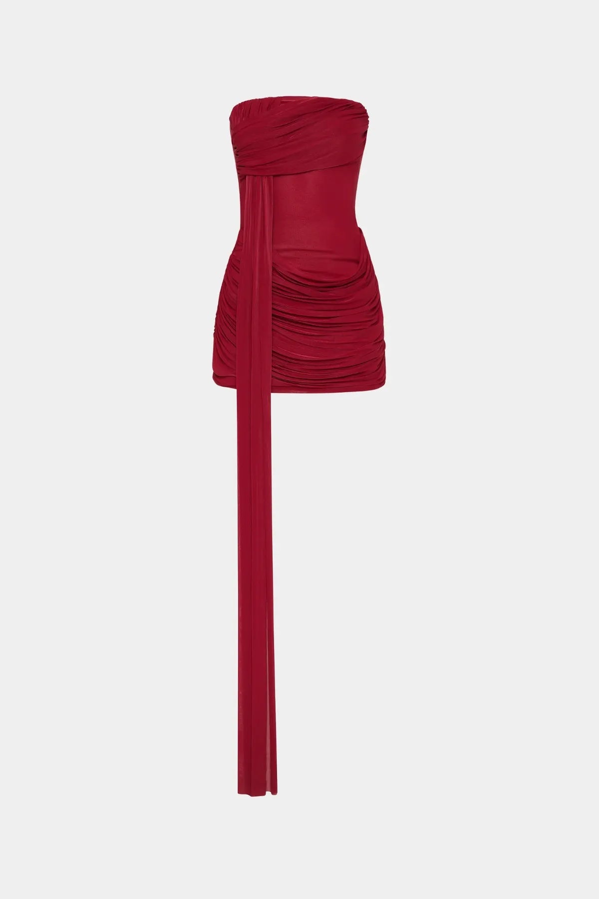 Ember Wrapped Mini Dress by MISHA — a strapless red mini with soft draping and a dramatic floor-length sash, perfect for evening events.