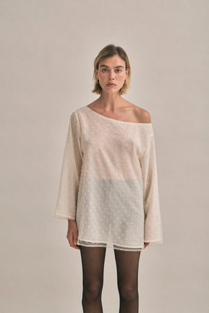 The Eloise Beaded Mini Ivory by Solaqua – sheer beaded mini dress with off shoulder neckline and oversized fit.