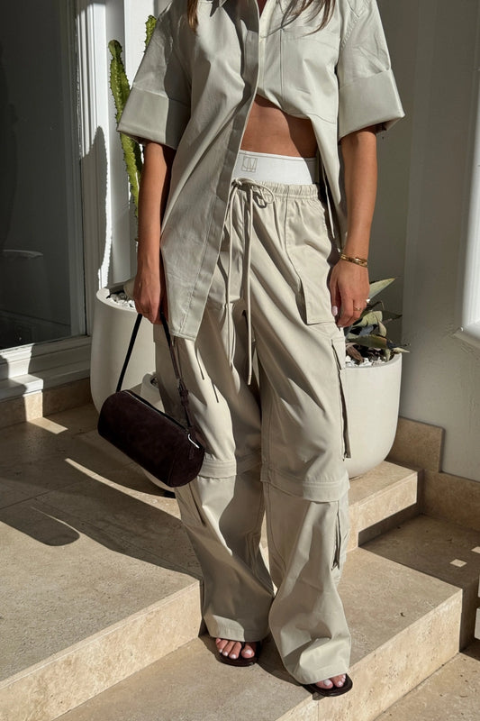 Soraya Cargo Pant Stone by Camilla and Marc, wide-leg recycled polyester cargo with 3D pockets and detachable detail, a trendy modern piece perfect for streetwear styling.