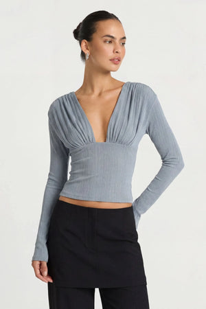 Agnes Top Mist Blue by Benni – ribbed long sleeve top with plunge neckline and gathered bust detailing.