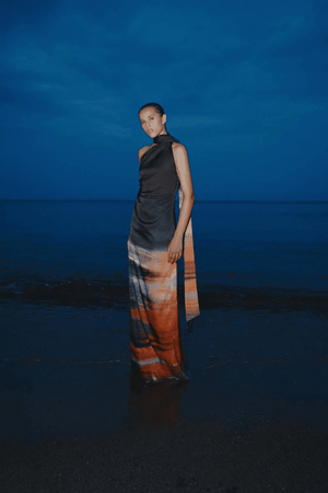 Ari Dress Tigre by Baobab – A bold, elegant one-shoulder maxi with ruched texture and scarf accent, perfect for making a trendy statement at evening events.