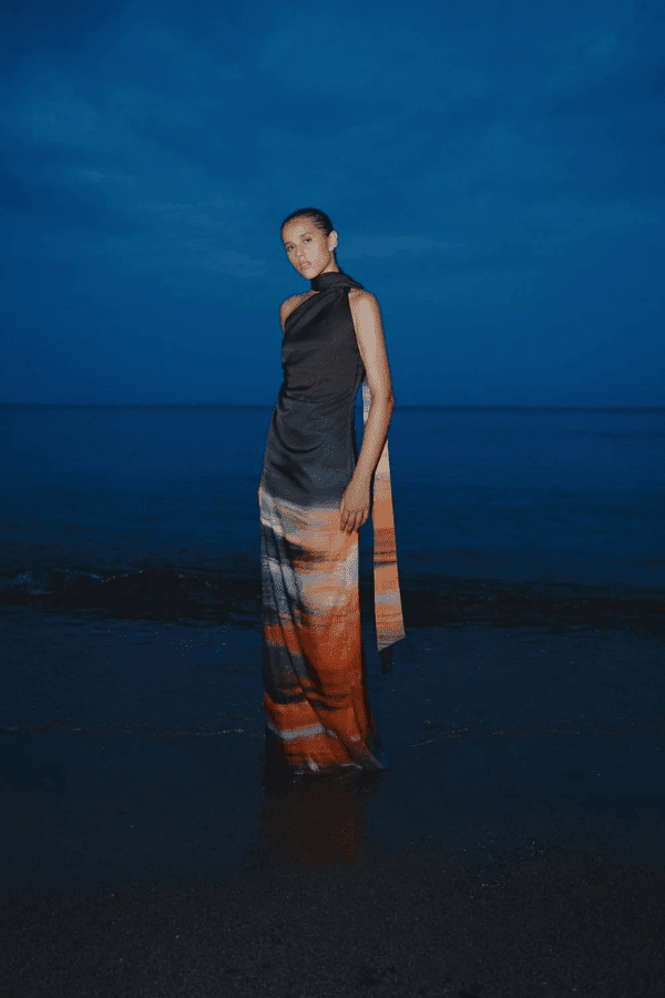 Ari Dress Tigre by Baobab – A bold, elegant one-shoulder maxi with ruched texture and scarf accent, perfect for making a trendy statement at evening events.