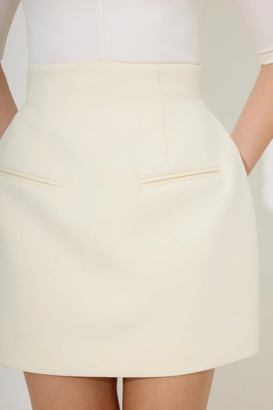 Cotton Mix Structured Skirt in Cream by Odd Muse – high-waisted tailored mini skirt with cinched waist and sleek fit.