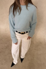Blue Kaia crew neck sweater with long sleeves and a relaxed fit.