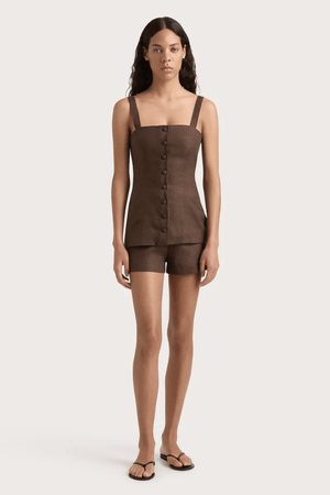 Corbiere Vest Bistre by Faithfull the Brand, sophisticated 100% European Flax® linen vest with wide straps, straight neckline, and mock buttons, perfect for trendy viral layering and elegant summer looks.