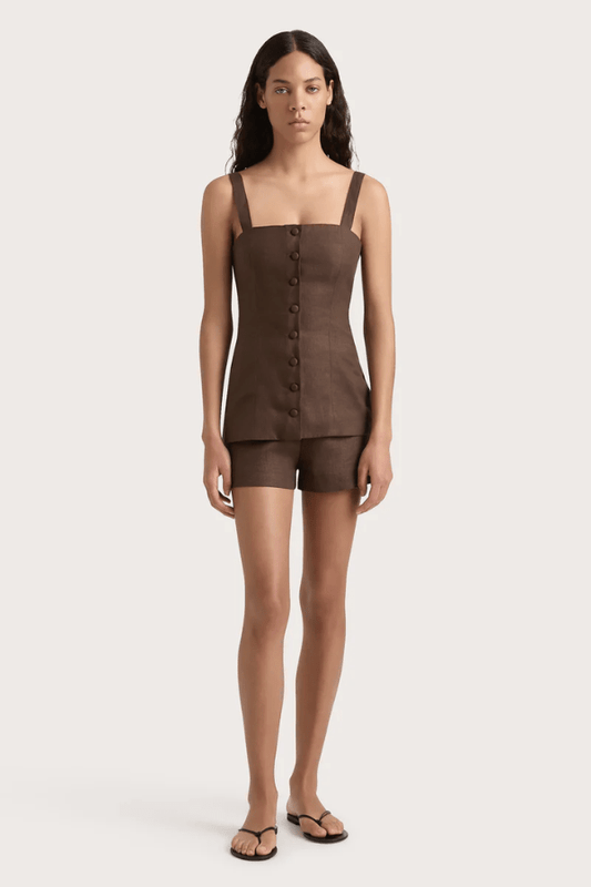 Corbiere Vest Bistre by Faithfull the Brand, sophisticated 100% European Flax® linen vest with wide straps, straight neckline, and mock buttons, perfect for trendy viral layering and elegant summer looks.