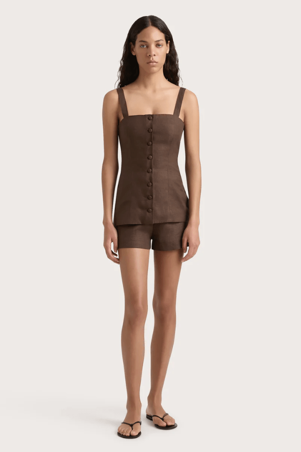 Corbiere Vest Bistre by Faithfull the Brand, sophisticated 100% European Flax® linen vest with wide straps, straight neckline, and mock buttons, perfect for trendy viral layering and elegant summer looks.