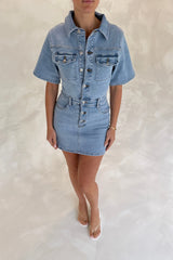 Katrina Denim Mini Dress in Light Blue Wash by Sneaky Link, stretch denim dress with cinched waist and button-up front.