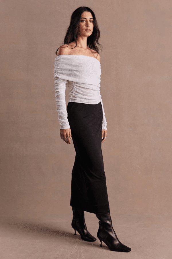 Emara Sleeveless Mini Dress Black by Sovere – fitted mini dress with pleats, keyhole neckline, tie details, and back zipper.