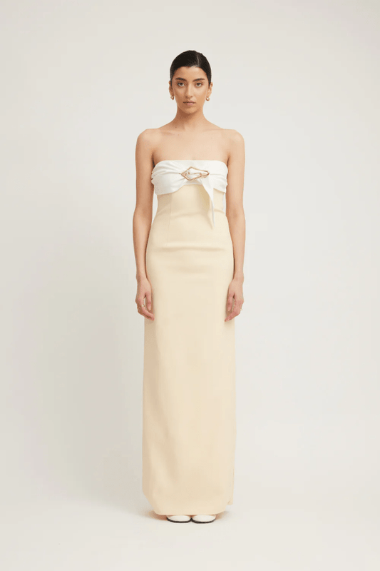 Kasai Dress Lemon/Ivory by Tojhà – A chic strapless maxi with structured bonded fabric, signature buckle detail, and princess seams, perfect for sophisticated events.