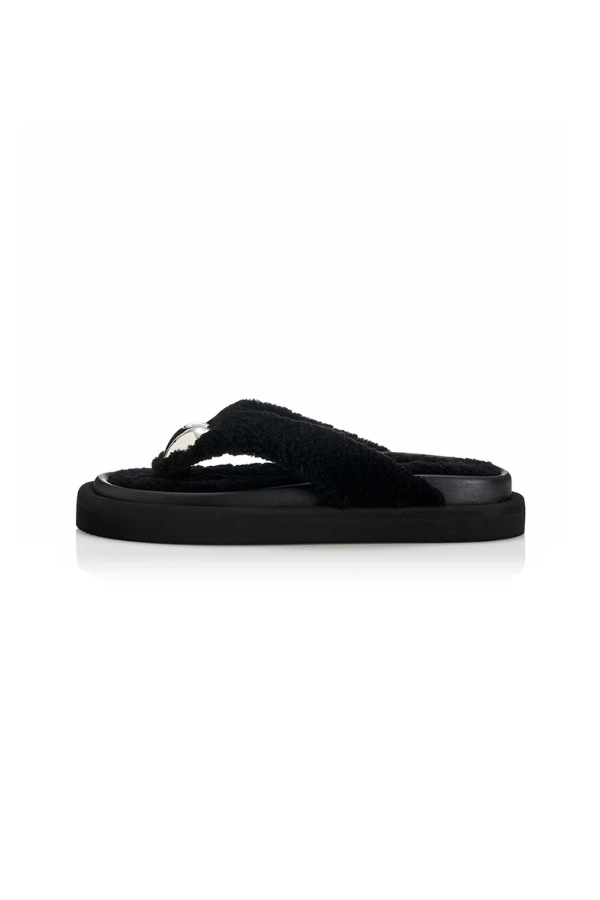 Ana Black Shearling by Alias Mae, elegant thong-style sandal crafted from 100% leather with a silver heart detail and 3.5cm heel. Size up if between sizes.