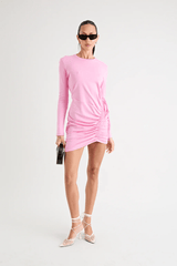 Rule Eight Dress Pink by Pfeiffer – A playful and polished cotton mini with adjustable side ruching, crew neckline, and full sleeves. Perfect for versatile day-to-night looks.