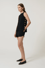 Anabel Top Black by Onte – Trendy A-line silhouette in heavy crepe knit with gold buttons, perfect for polished day-to-night looks and pairing with Pilar Shorts.