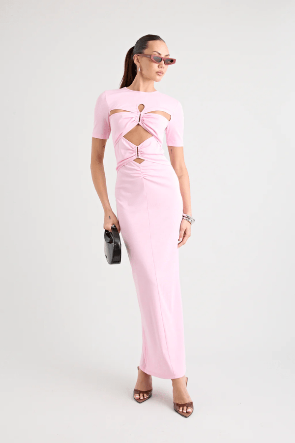Florence Dress Pink by Pfeiffer – A trendy fitted maxi with cut-out hardware accents, crafted from soft cotton-spandex. Perfect for chic, ethical day-to-night wear. Made in Australia with care.