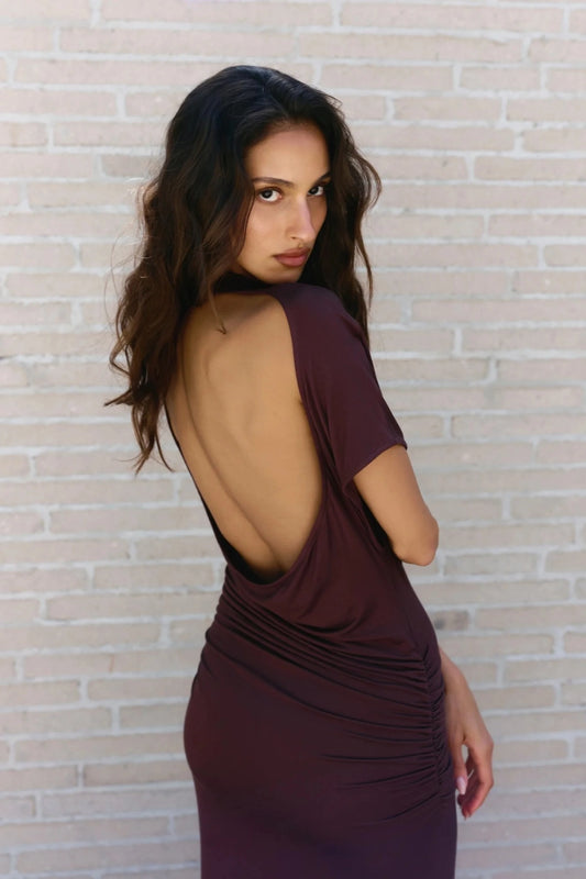 Yvone Midi Dress in Chocolate by Bayse, a fitted midi dress with a high neckline, waist ruching, and back cut-out detail.