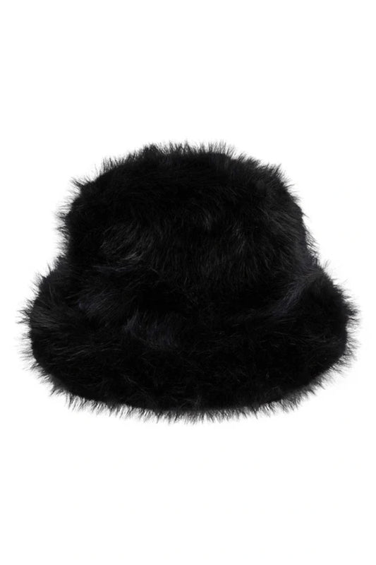 Snuggle Bucket Black by Lack of Color, a faux fur bucket hat with turnback brim and silky lining. Perfect for cozy winter styling.