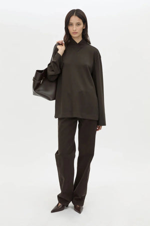 Bessette Long Sleeve Top in Espresso by Camilla and Marc, a sleek high-neck layer with side splits and tonal seam detailing.