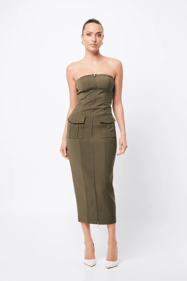 Low Profile Midi Dress Khaki by Mossman – A chic, strapless utility-inspired midi with exposed zip, front pockets, and back split, perfect for modern, versatile styling.