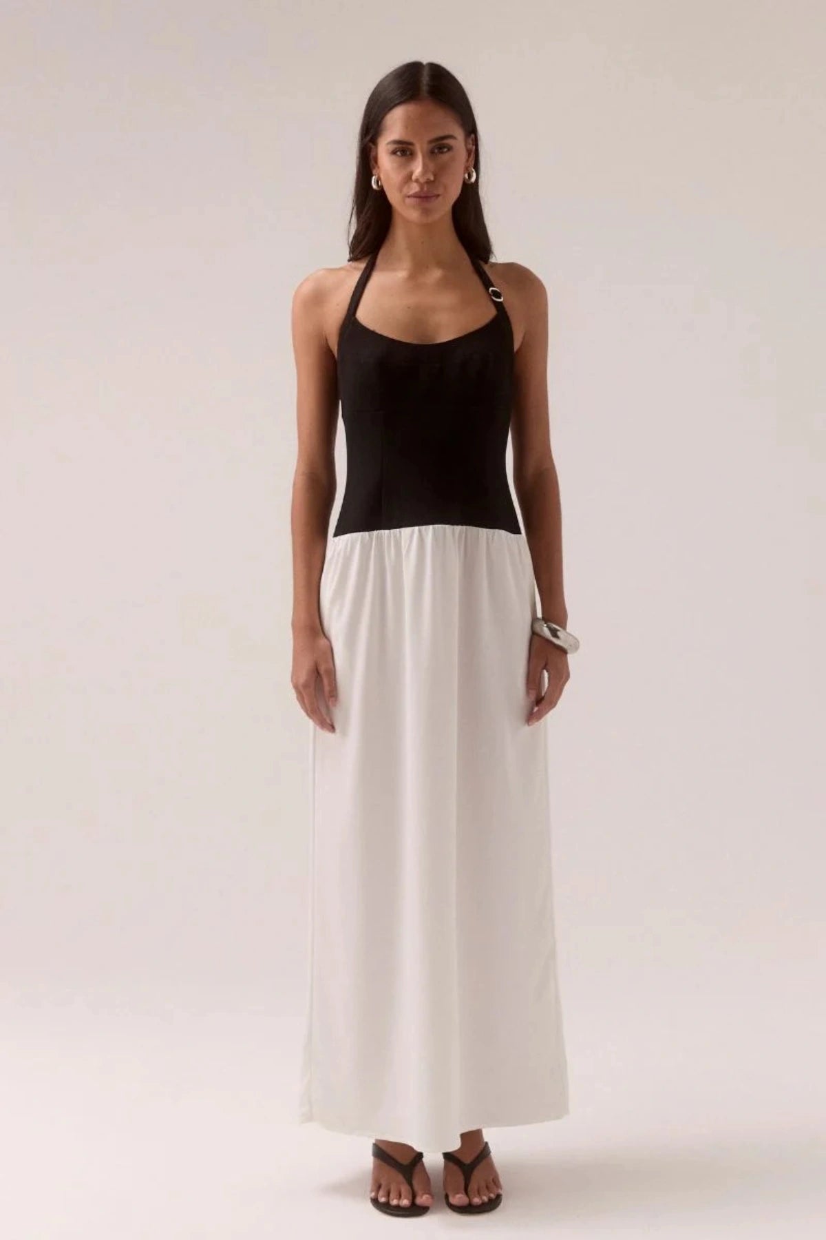 Demi Dress Black/Chalk by Sovere, halter maxi with scooped neckline and flowy skirt, a trendy piece perfect for elegant evenings or events.