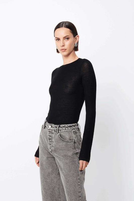 Maine Long Sleeve Top Black by Mossman – A viral, lightweight Merino wool essential with a sleek round neck and body-skimming fit, perfect for year-round layering or solo wear.