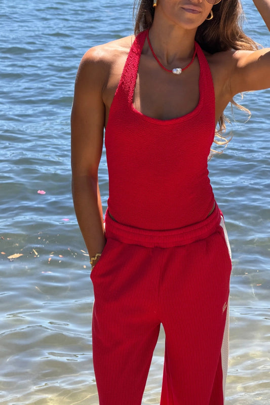 Sandy Swim in Red by Hunza G, halterneck one-piece in sculpting seersucker crinkle fabric. Timeless, flattering, and vacation-ready.
