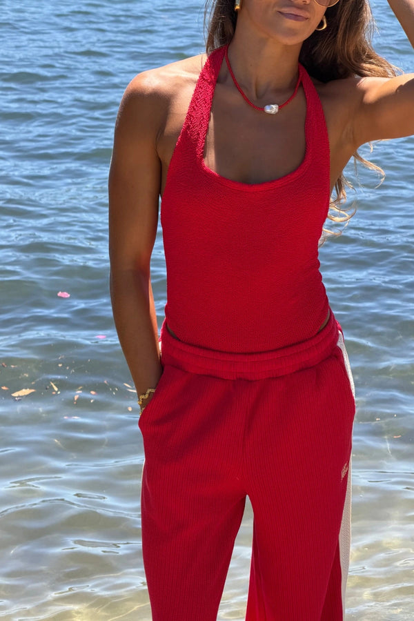 Sandy Swim in Red by Hunza G, halterneck one-piece in sculpting seersucker crinkle fabric. Timeless, flattering, and vacation-ready.
