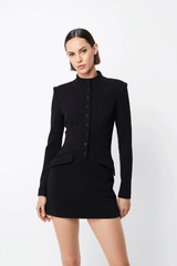 Network Mini Dress Black by Mossman – A sleek, structured LBD with padded shoulders, high neckline, and functional pockets, perfect for day-to-night chic.