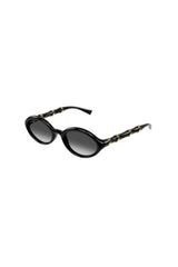 GG2059S001 Black by Gucci – oval sunglasses with bamboo detail and slim frame. Perfect for elevated styling.