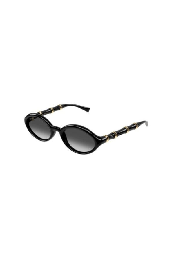 GG2059S001 Black by Gucci – oval sunglasses with bamboo detail and slim frame. Perfect for elevated styling.