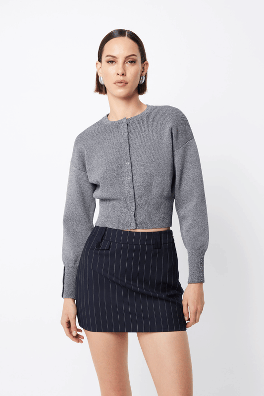 Manhattan Cardigan Pale Grey by Mossman – Relaxed fit crepe knit with round neck, press stud front, ribbed cuffs, and waistband. Soft with stretch. Model wears AU 6.