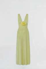 Orinoco Lime by Maygel Coronel – Maxi dress with deep V-neck, ruched bodice, 3D flowers, wide straps, and flowing skirt.