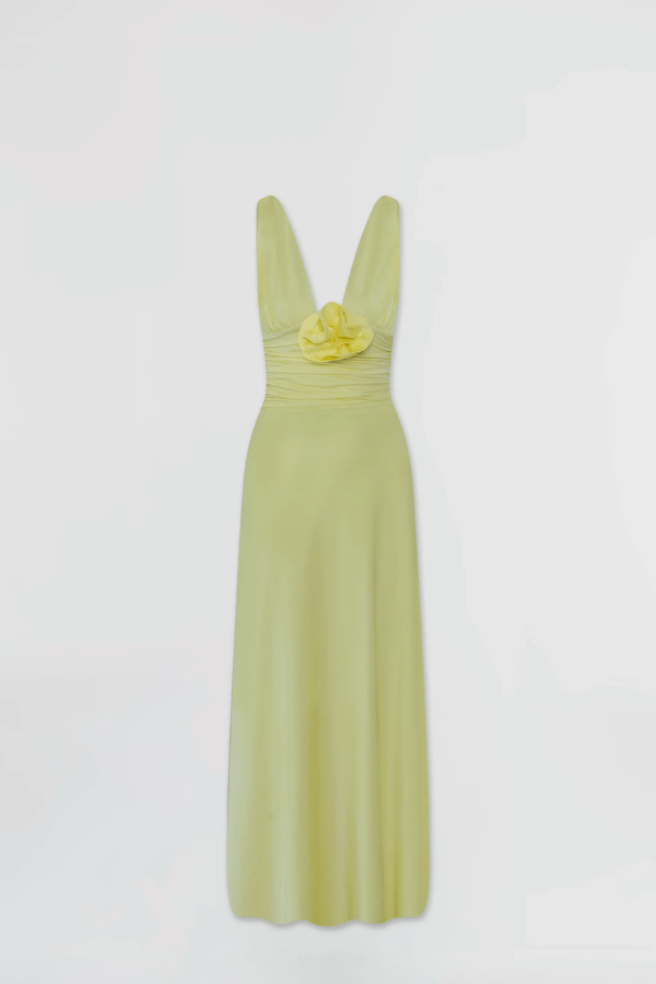 Orinoco Lime by Maygel Coronel – Maxi dress with deep V-neck, ruched bodice, 3D flowers, wide straps, and flowing skirt.
