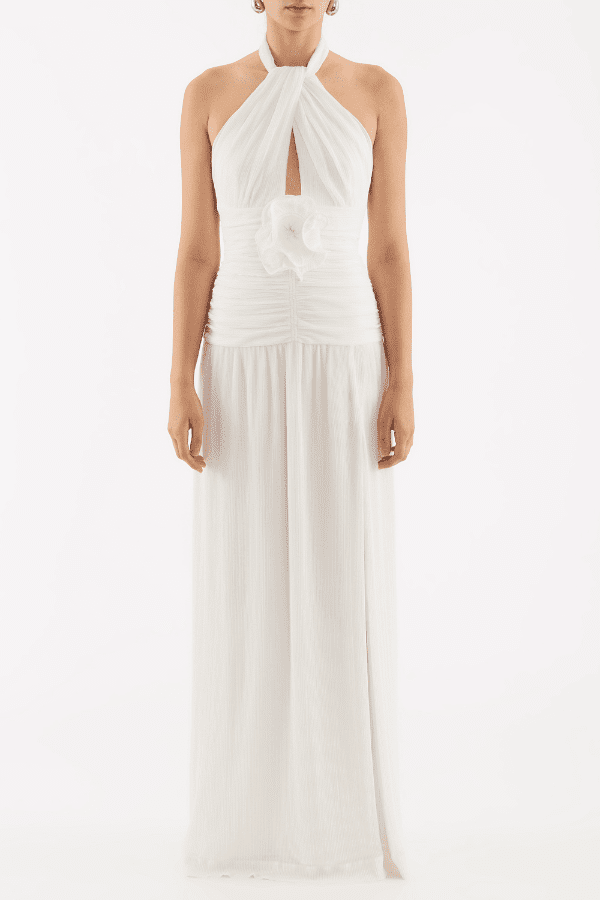 Guinevere Halter Gown Ivory by Rebecca Vallance – Halter gown with ruched waist, floral applique, open back, and front split.